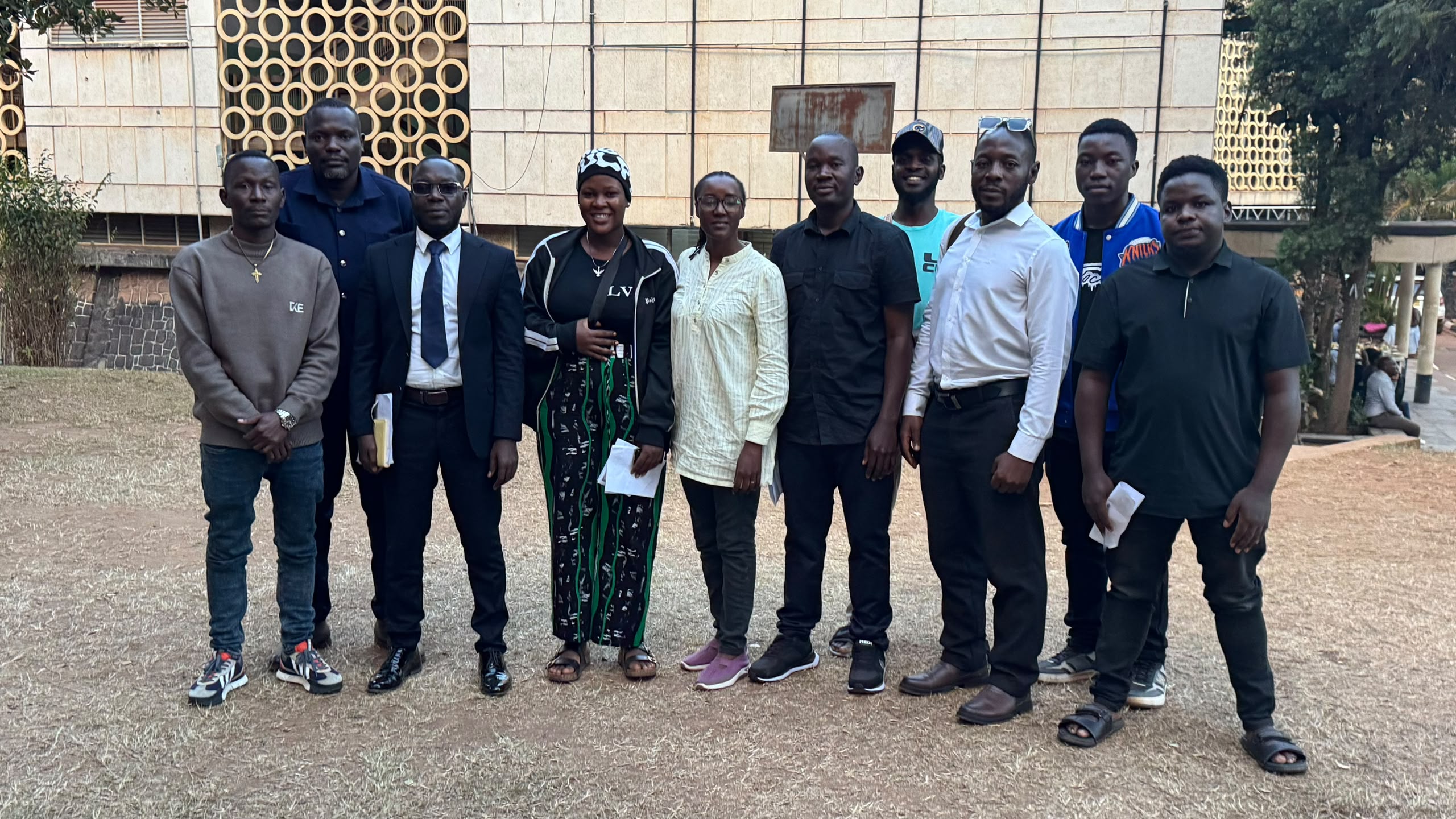 A group gathered outside a building for a community photograph
